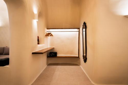 a small hallway with a window in a room at Approxi Cave: 2-Bedroom Retreat in Éxo Goniá