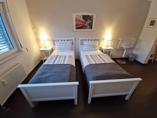 En eller flere senge i et værelse på Hotel zum Postwagen