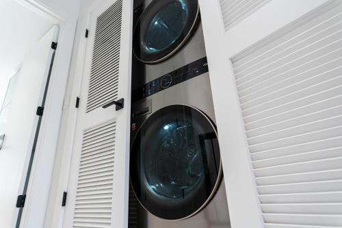 a washing machine in a room with two doors at The Georgetown House Inn in Washington