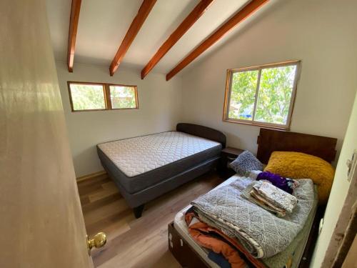 Giường trong phòng chung tại Cabaña en San Jose de Maipo