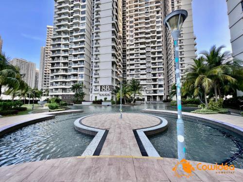 a swimming pool in front of some tall buildings at DangaBay in CountryGarden - Fantastic2 #Cowidea in Johor Bahru