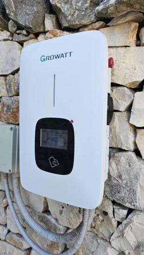 a white thermostat attached to a stone wall at Agriturismo Masseria Aprile in Locorotondo