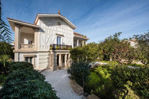 a large white house with a balcony on a hill at Palazzo Bove 2 - Villa Dagmar in Galatone