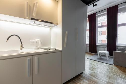Η κουζίνα ή μικρή κουζίνα στο Chełmońskiego 8-04 by Farkas Apartments