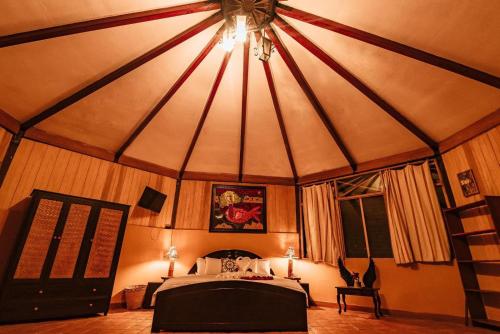 a bedroom with a bed in a tent at Casa Hospedaje Sangapilla in Lamas