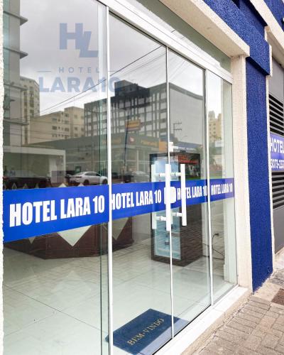 a hotel laraja hotel lax sign in a store window at Hotel Lara 10 Curitiba in Curitiba