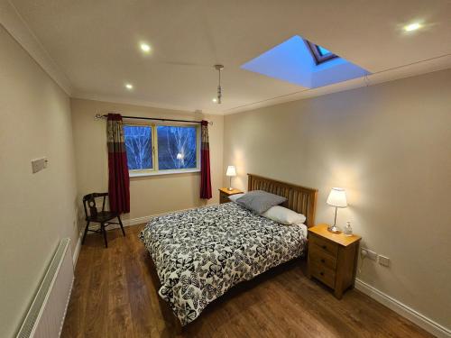 a bedroom with a bed and a blue ceiling at Central Westport Town House in Westport