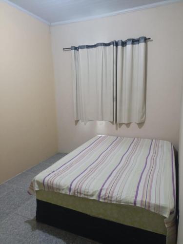 Postel nebo postele na pokoji v ubytování Casa prox a praia de itapua