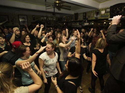 a crowd of people dancing in a room at Hajo´s Germania Lodge & Irish Pub in Rüdesheim am Rhein