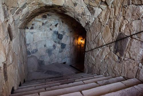 a stone tunnel with stairs in a stone wall at Rosell Boher Winery Lodge & Spa in Agrelo