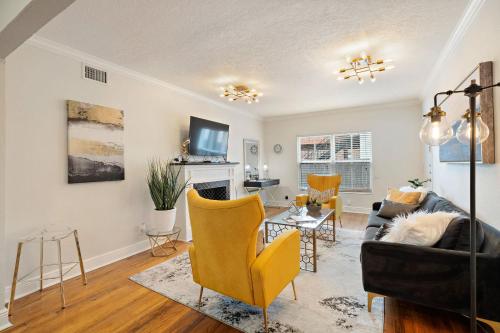 a living room with a couch and chairs at The Bishop's Haven in Houston