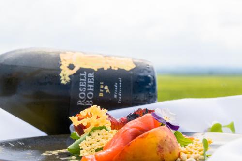 a plate of food next to a bottle of wine at Rosell Boher Winery Lodge & Spa in Agrelo