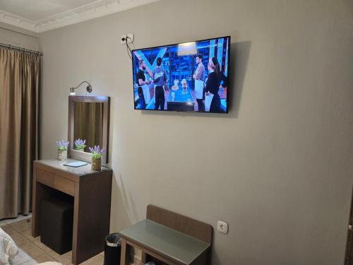 Télévision ou salle de divertissement dans l'établissement Hotel Anastasia