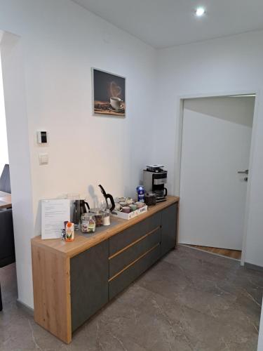 a kitchen with a counter with a coffee maker on it at Ferienapartment "Zur Linde" in Breitenstein