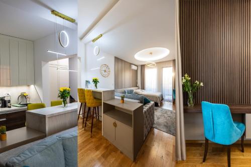 two images of a kitchen and a living room at 4 Ljubavi in Palić