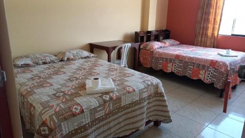 Cama o camas de una habitación en Hospedaje Huamani & Mi Casa