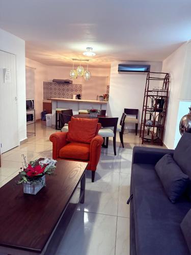 a living room with a couch and a table at Newly renovated ! Villa Laguna Cancun in Cancún