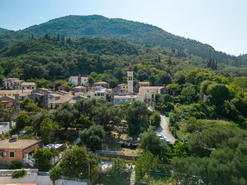 an aerial view of a small town with a mountain at Mountain Mini Suite in Áyioi Dhéka