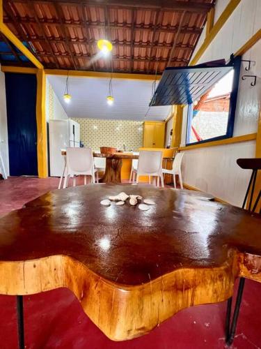 a large wooden table in the middle of a room at Casa de Praia Tutóia in Tutóia