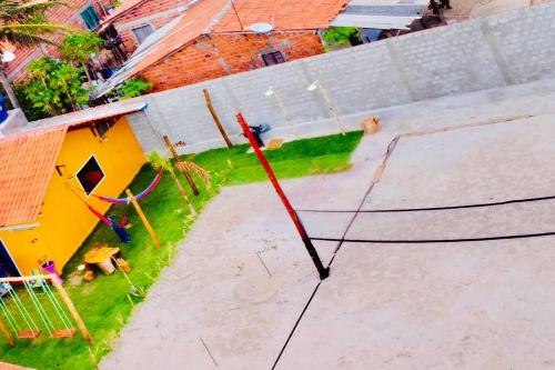 an aerial view of a playground with a tennis court at Casa de Praia Tutóia in Tutóia