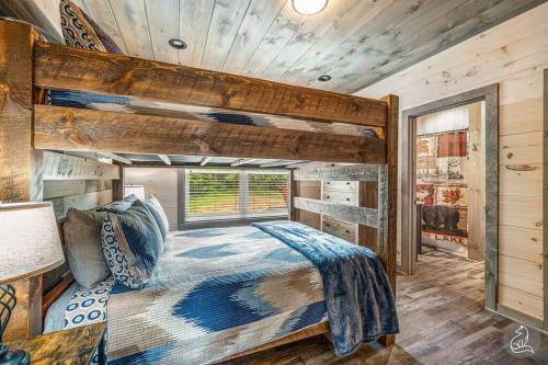 a bedroom with a large bed and a wooden ceiling at The Water Fox in Sevierville with Indoor Pool, Hot Tub, Game Rm, and Theater in Sevierville