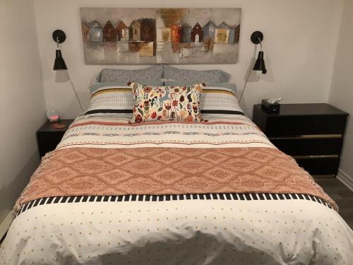 En eller flere senge i et værelse på Simplement l’Harmonie à Chambly