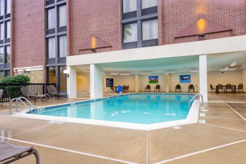 a large pool in the courtyard of a hotel at Drury Inn & Suites Houston Galleria in Houston