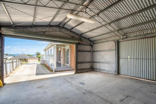 an empty garage with a large metal building at Views on the Avenue in Clifton Springs