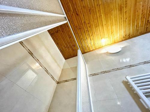 an empty room with a tile floor and a ceiling at Villas el Alto in Moya