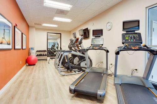 a gym with treadmills and elliptical machines at Drury Inn & Suites Greenville in Greenville