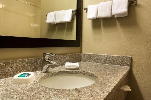 a bathroom with a sink in a hotel room at Drury Inn & Suites Cincinnati Sharonville in Sharonville