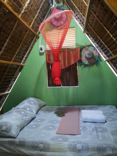 Katil atau katil-katil dalam bilik di Lagkaw Dos in Lagkaw Homestay