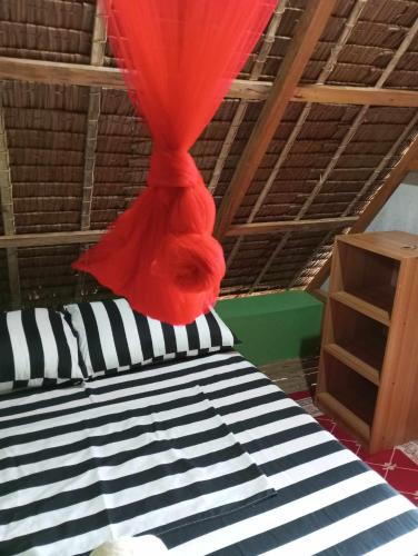 Katil atau katil-katil dalam bilik di Lagkaw Dos in Lagkaw Homestay