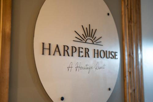 a mirror on a wall with a harper house sign at Harper House in Santa Clara
