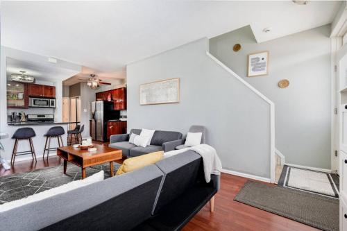 a living room with a couch and a table at 3 King Beds/Charm in Historic STL by StayStLouis in Soulard