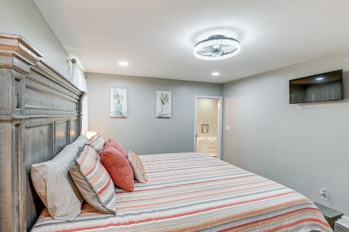 a bedroom with a large bed with a wooden headboard at Family-Friendly Home with Yard 27 Mi to Nashville! in Springfield