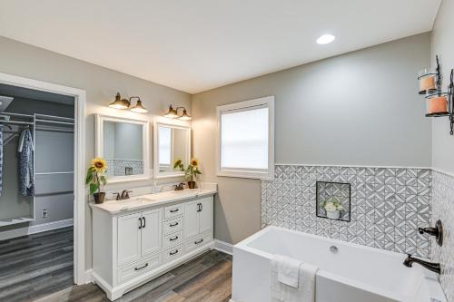 a bathroom with a tub and a sink at Family-Friendly Home with Yard 27 Mi to Nashville! in Springfield