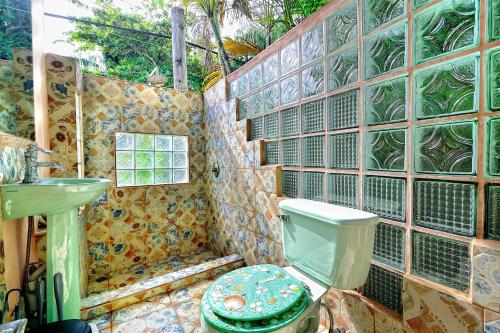a bathroom with a toilet and a sink at Cabarete Boutique Kite Hotel King Loft in Cabarete
