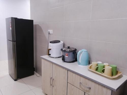 Kuchyň nebo kuchyňský kout v ubytování Marvelous Homestay SP Kedah