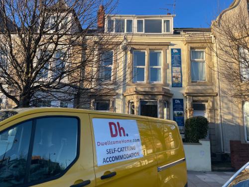 a yellow van parked in front of a building at Entire 8 Ensuite Bedroom Coastal Holiday Home Townhouse, Free Parking, Fully Equipped Kitchen, Dining Room & Lounge, Perfect for Family Gatherings, Long Term Contractor, Relocation, etc Stays, 20 mins to Sunderland & Newcastle, See our Site for Assurance in South Shields