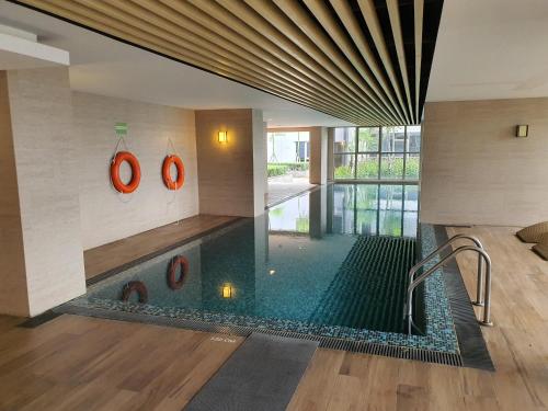 a pool in the middle of a building at 2BedRooms Apartment in Gold Coast PIK in Jakarta