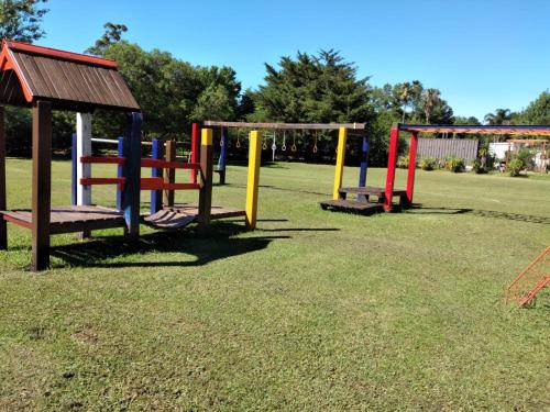a group of colorful playground equipment in a park at Solanas Termas de Dayman in Termas del Daymán