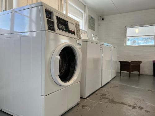a washer and dryer in a laundry room at Key Lime Tiny Home New&Cozy in Sarasota