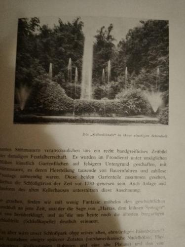 a page of a book with a picture of a fountain at Ruhig und spartanisch Wohnen im Denkmal in Lichtenwalde