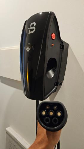 a persons hand holding a wii remote control at Perfect Port Melbourne Townhouse in Melbourne