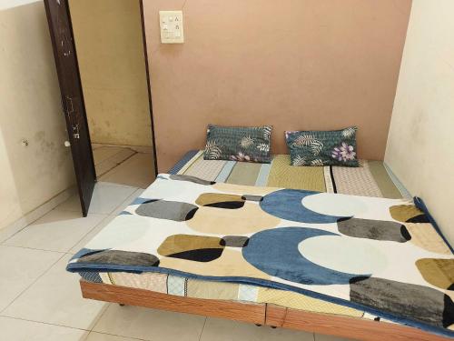 a bedroom with two beds with a cow blanket at SPOT ON Hotel VIP Inn in Jamnagar