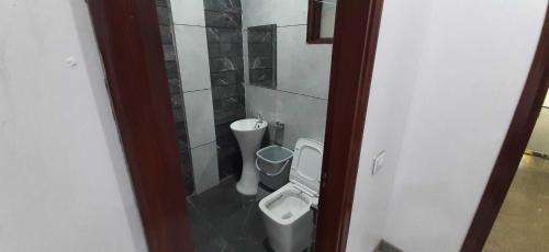 a bathroom with a toilet and a bidet at OYO HOTEL BLISS in Ludhiana