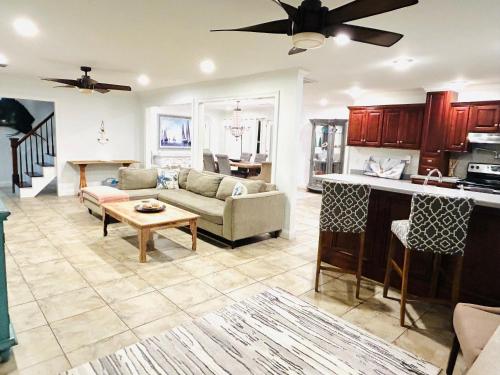 a living room with a couch and a table at 4/3 Home Centrally Located, beach, casino, airport, dining, golfing, shopping, entertainment in Gulfport