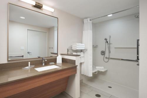 a bathroom with a sink and a mirror at Fairfield by Marriott Inn & Suites Hardeeville I-95 North in Hardeeville
