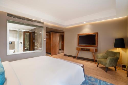 Postel nebo postele na pokoji v ubytování Radisson Blu Resort Dharamshala